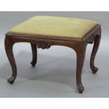 A Victorian rose wood stool the drop in top upholstered in green Draylon on cameo headed scrolling