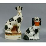 A Victorian Staffordshire flatback figure of a spaniel with iron red filled basket in its mouth,
