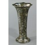 A silver cased waisted spill vase embossed with sunflowers and buds and leafage, spreading oval