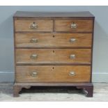 A Regency mahogany chest of drawers outlined throughout with boxwood stringing and broad crossbanded