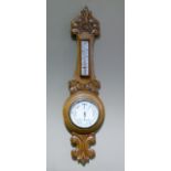 A Victorian oak case barometer with thermometer by R H White and Co, Leeds, 70cm high