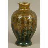 A JAPANESE POTTERY VASE, Meiji period, of baluster form, the glazed dark green to brown ground