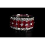 A RUBY AND DIAMOND BAND RING IN 18CT WHITE GOLD, the brilliant cut diamonds and calibre cut rubies