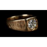 A SINGLE STONE DIAMOND RING in 9ct gold the brilliant cut stone grain set within a square bezel