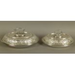 A PAIR OF EARLY 20TH CENTURY SILVER PLATED OVAL TUREENS AND COVERS, with detachable beaded loop