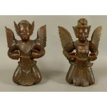 A PAIR OF BURMESE/THAI CARVED HARDWOOD MALE AND FEMALE DEITY, late 19th/early 20th century, the