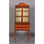 A LATE VICTORIAN SHERATON REVIVAL SATINWOOD BOOKCASE ON STAND, the arched top with applied cavetto