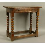 A 17TH CENTURY OAK SINGLE DRAWER SIDE TABLE, the twin plank top above a figured drawer with