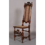 A WILLIAM AND MARY WALNUT AND BEECH HIGH BACK CHAIR with pierced scroll carved cresting rail above a