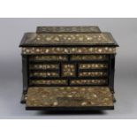 A DUTCH COLONIAL EBONISED CASKET 17TH CENTURY inlaid overall with mother-of-pearl flowerheads on a