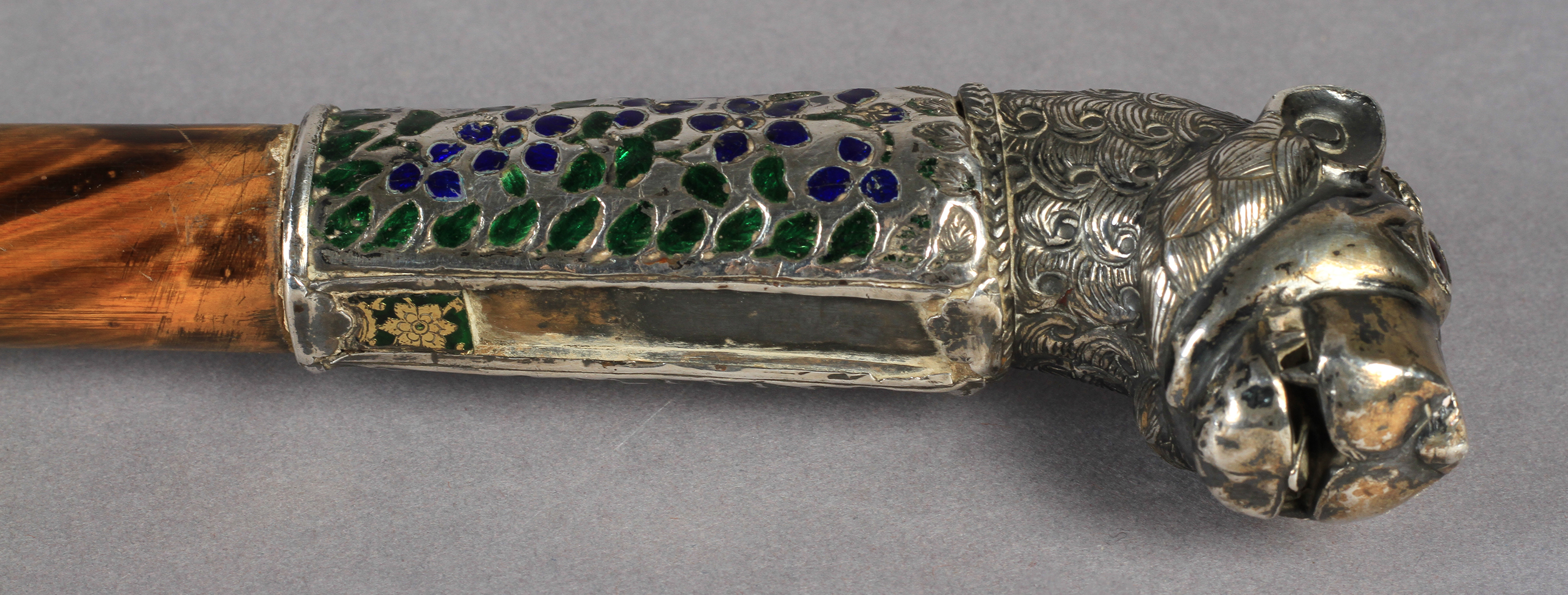 A 19TH CENTURY SILVER COLOURED METAL, ENAMEL AND GLASS WALKING STICK terminal cast as a lion's - Image 3 of 4