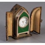 A LATE VICTORIAN SILVER CASE AND ENAMEL BOUDOIR CLOCK of lancet shape, the green enamelled face of