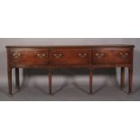 AN 18TH CENTURY OAK DRESSER, the planked top with moulded edge, above three deep drawers with