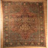 A RAVAR KERMAN PERSIAN CARPET early 20th century in dark blue, crimson, pale blue, green and ivory