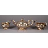 A WILLIAM IV COMPOSITE THREE PIECE TEA SERVICE by E E & J W Barnard, London, the teapot 1830, the
