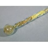 A VICTORIAN SPIRAL MOULDED GLASS WALKING CANE with spherical pommel, internally decorated with