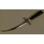 A VICTORIAN PAPER KNIFE, the tapered ebonised handle inset with a silver coloured metal oval