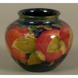 A WILLIAM MOORCROFT POMEGRANATE DESIGN VASE c.1913 ovoid with slightly everted rim, tubelined and