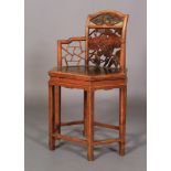 A CHINESE ELM ELBOW CHAIR, the arched back with panelled top carved with fan shaped panel of