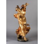 A GOLDSCHEIDER ART NOUVEAU FIGURE - Rose, she carries a flambeau torch in each hand and wears a
