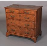 A GEORGE III WALNUT DWARF CHEST OF DRAWERS crossbanded and inlaid in boxwood and ebony stringing,