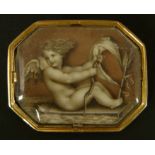 A 19TH CENTURY AMORINI BROOCH, the sepia image of cupid under glass, octagonal outline, glazed