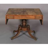 A REGENCY ROSEWOOD SOFA TABLE, having twin drop leaves, beaded flush frieze drawer and opposing