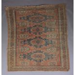A SOUMAC CARPET, East Caucasus the terracotta field with a column of four blue stepped medallions,