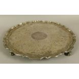 A LARGE PLATED ON COPPER TRAY, 19th century circular with pie crust rim, the centre engraved to