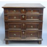 A LATE 17TH CENTURY OAK CHEST of four graduated twin indented panel drawers with moulded frames,