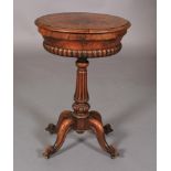 AN EARLY VICTORIAN BURR WALNUT VENEERED TEAPOY, oval, the hinged lid revealing an interior with pair