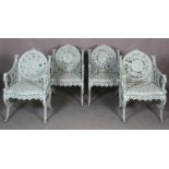 A SET OF FOUR CAST IRON 'SEASONS' CHAIRS, each back with a roundel of infants, an amorini within