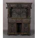 AN OAK DRESSER/CUPBOARD in 16th century style, dentil moulded cornice above a frieze centred on a
