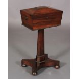 A REGENCY ROSEWOOD VENEERED TEAPOY of conventional form, the sarcophagus shaped top with reel