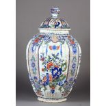 A LARGE POLYCHROME DELFT VASE AND COVER, 19TH CENTURY the ribbed ovoid body and domed cover with