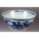 A LARGE CHINESE BLUE AND WHITE BOWL 19th century painted to the exterior with a continuous pagoda