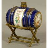 A LATE 19TH CENTURY FRENCH PORCELAIN AND GILT-BRONZE MOUNTED SPIRIT BARREL, the porcelain barrel