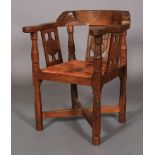 A THOMPSON OF KILBURN 'MOUSEMAN' OAK MONK'S CHAIR the top rail terminating with a face mask to