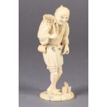 A JAPANESE IVORY OKIMONO OF A FISHERMAN, standing, a basket on his back and a hook in his hand,