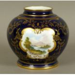 A COALPORT COMPRESSED BALUSTER VASE, the royal blue ground painted with a shaped reserve of a