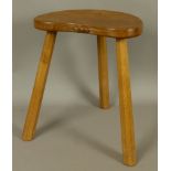 A THOMPSON OF KILBURN 'MOUSEMAN' OAK STOOL on three octagonal tapered legs, carved in relief with