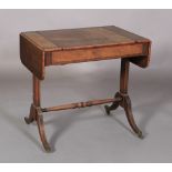 A REGENCY MAHOGANY SOFA GAMES TABLE, the rounded rectangular top with pair of hinged leaves and