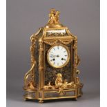 A FINE FRENCH ORMOLU MANTEL CLOCK, the ornate glazed case decorated internally with floral, leaf and