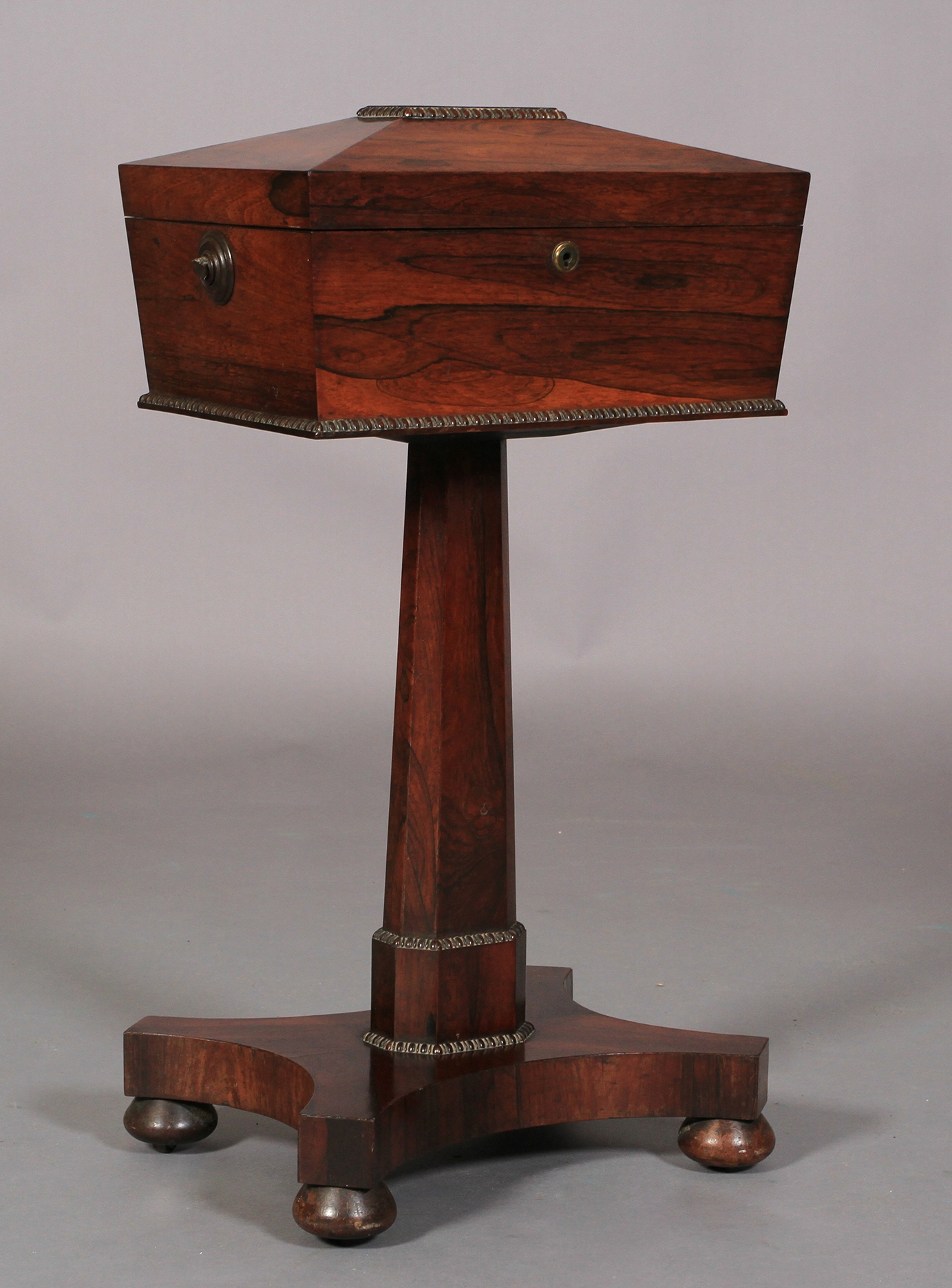 A REGENCY ROSEWOOD VENEERED TEAPOY of conventional form, the sarcophagus shaped top with reel - Image 2 of 3