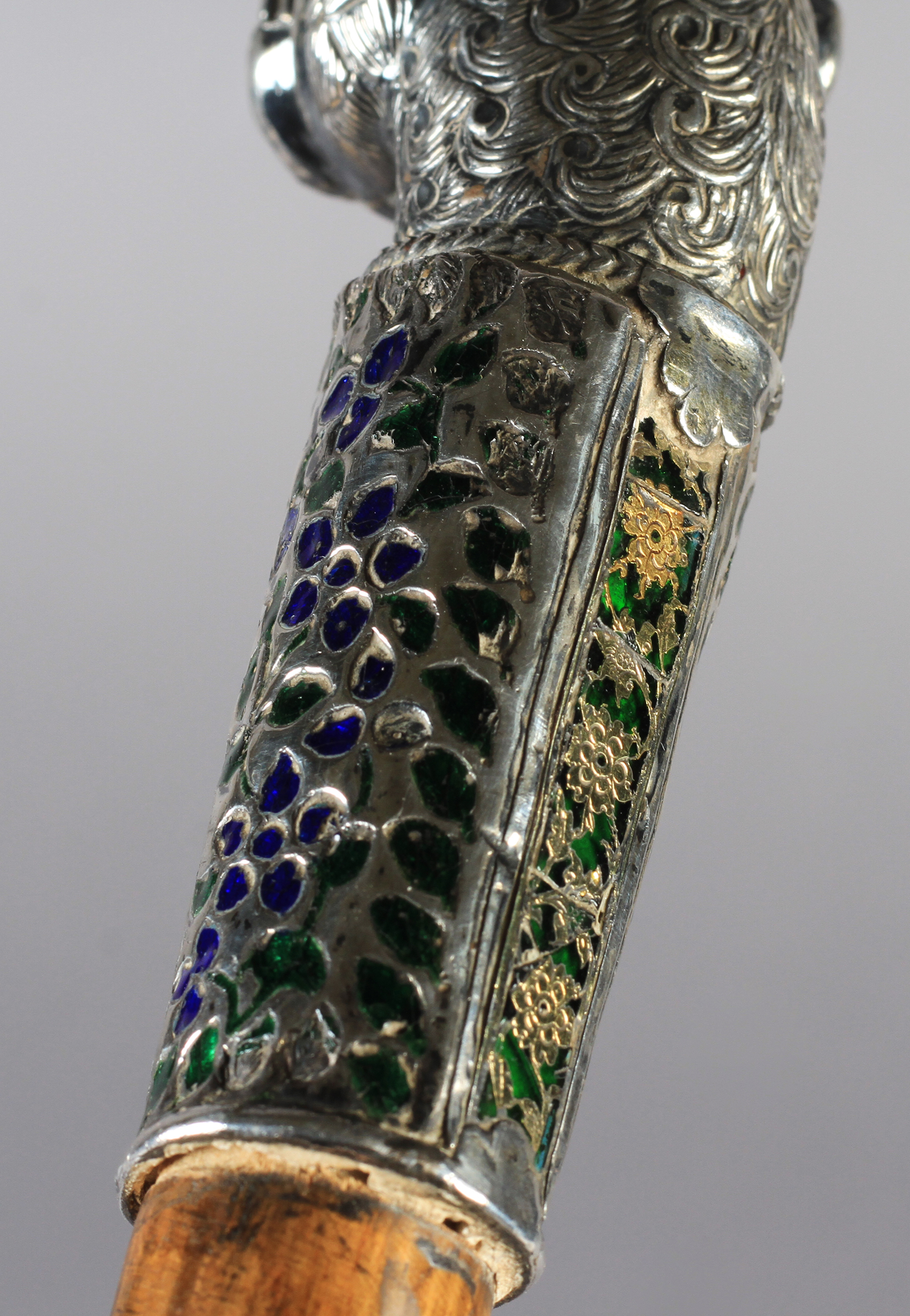 A 19TH CENTURY SILVER COLOURED METAL, ENAMEL AND GLASS WALKING STICK terminal cast as a lion's - Image 4 of 4