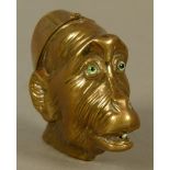 A VICTORIAN BRASS MONKEY HEAD VESTA, hinged lid as a cap, realistically embossed with fur, open