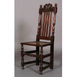 A LATE 17TH CENTURY OAK SINGLE CHAIR c.1690 having a pierced and scrolled cresting above a slate