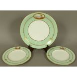 A ROYAL WORCESTER CIRCULAR CABINET PLATE, the pale green rim with an oval reserve painted by