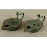 A PAIR OF LATE 19TH CENTURY ROMAN STYLE LAMPS, bronze-finished the pierced cover with Egyptian