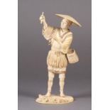 A FINE JAPANESE IVORY OKIMONO OF A FISHERMAN, standing on a rock, a fishing net pegged down in the